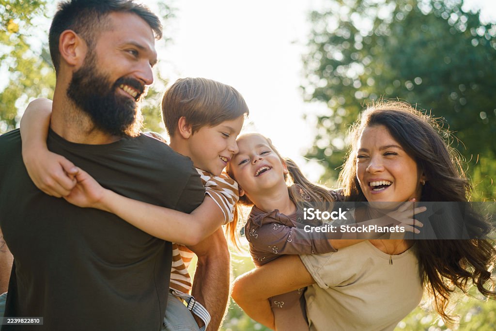 Family laughing together outdoors